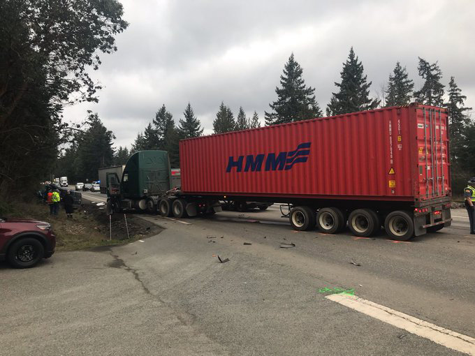 A semi-trailer truck blocks Highway 101 near Orcas Drive after a collision Wednesday afternoon shut down the highway.